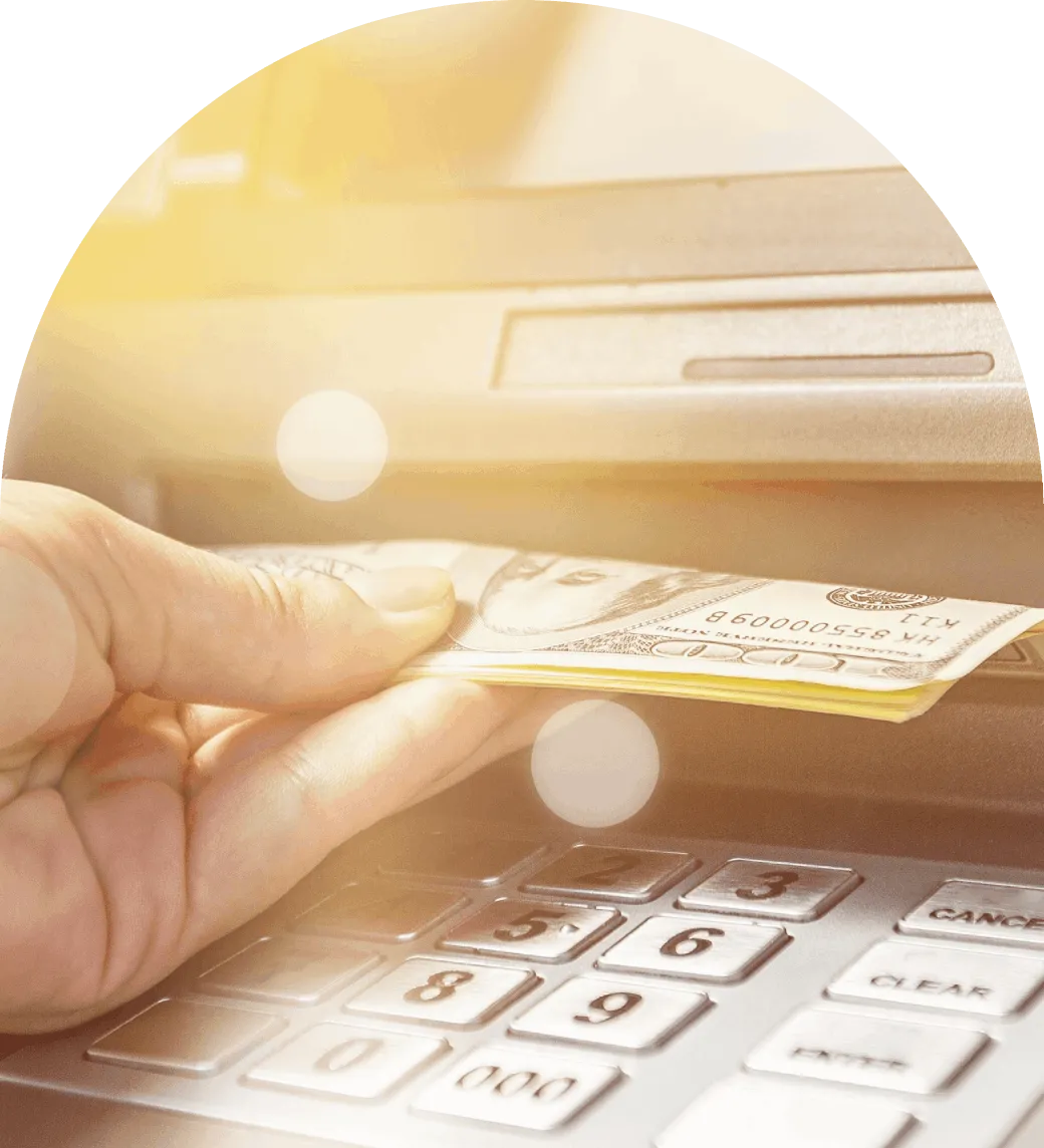 a person collecting money from an atm